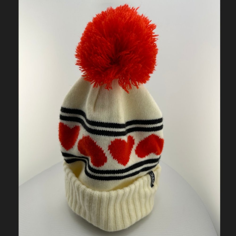 Dakine Pom Beanie Hat, cream, black and red.
